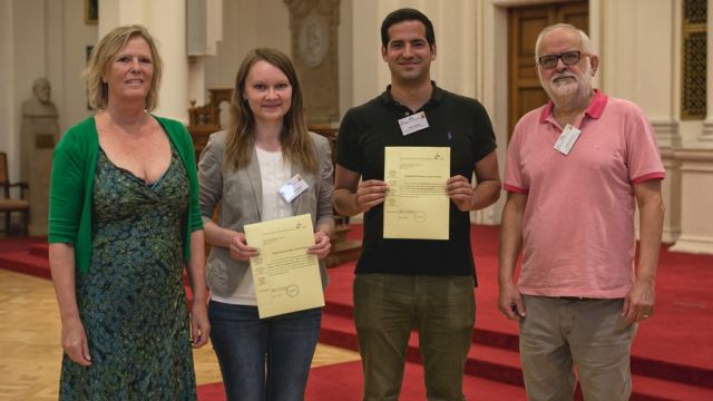 University of Graz Vice Dean of the Humanities Ineke Mennen and MESEA President Yiorgos Kalogeras congratulate the winners of this year’s Young Scholars Excellence Award Tatiana Prorokova and Daniel Valella